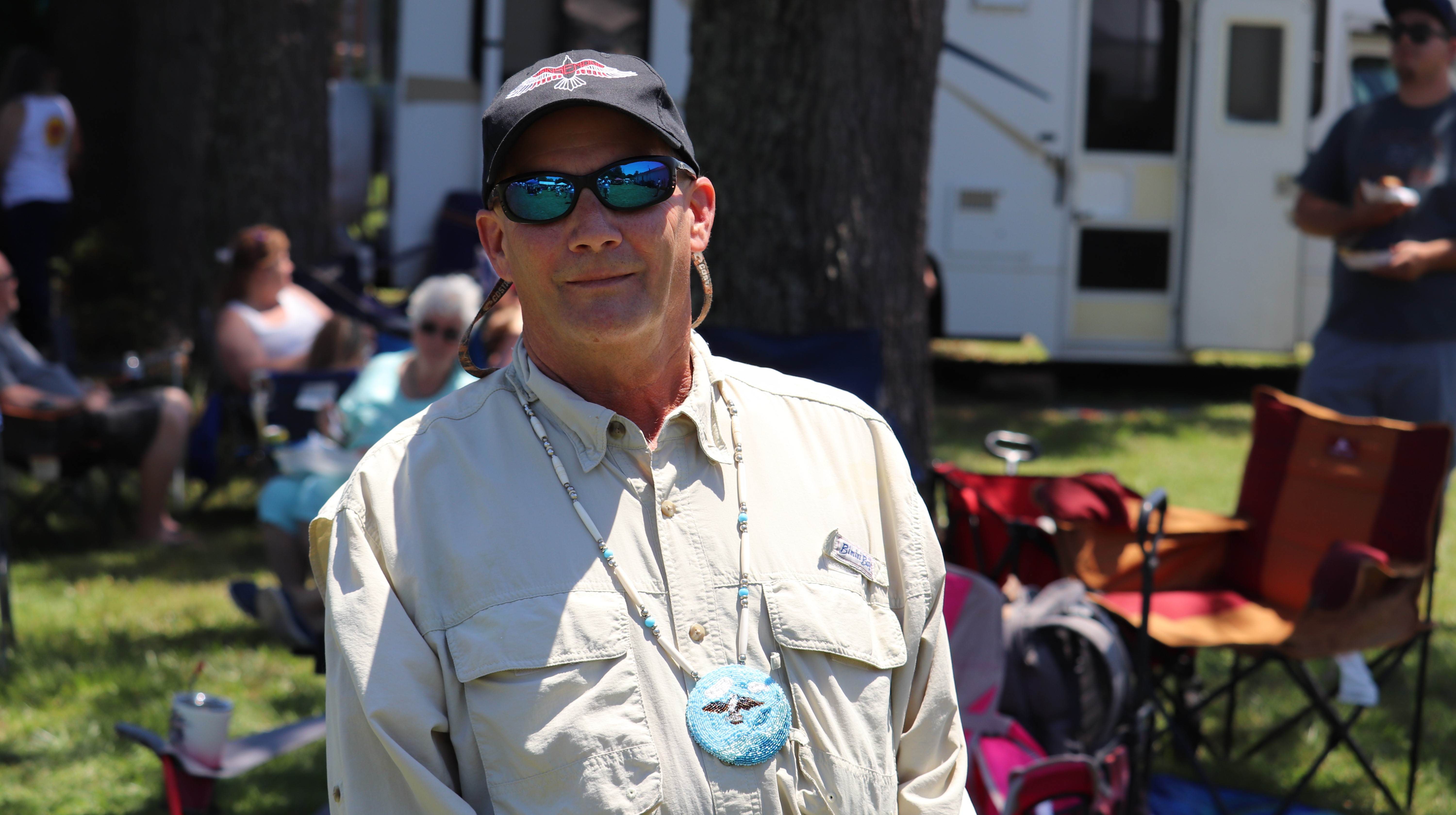 A Person Wearing a Hat and Sunglasses